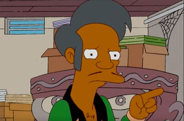 Apu Nahasapeemapetilon. Cartoon of South Asian male with gray hair, thin mustache, wearing green shirt with black collar.