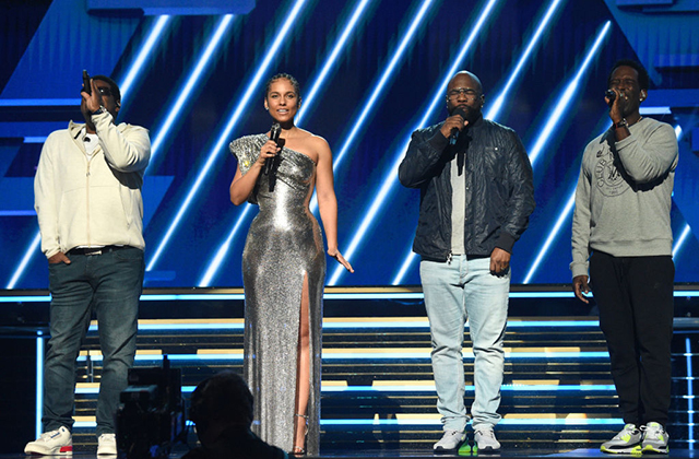 The Grammys. Alicia Keys with Boyz II Men Nathan Morris, Wanya Morris and Shawn Stockman on stage.