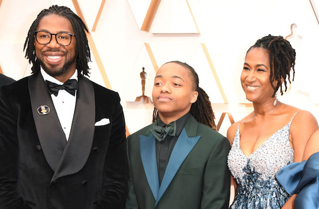 Hair Love. A Black man in a tuxedo with locs, a teen boy with locs in a tuxedo with blue lapels and a Black woman with locs and a silver and blue sequin gown.