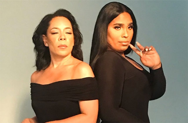 Selenis and Marizol Leyva. Two Latinx women standing side-by-side. They both have long dark hair wearing black dresses.