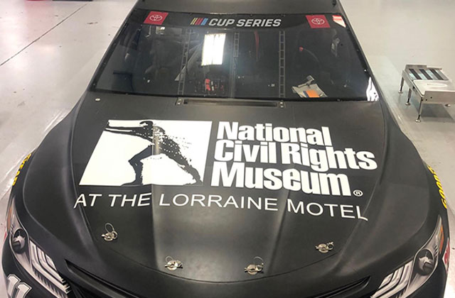 NASCAR. Black car with hood reading "National Civil Rights Museum at the Lorraine Motel" and a logo.