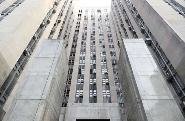 View looking up at tall state supreme court building in New York City.