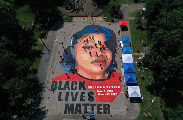 large mural on the ground of Breonna Taylor's face