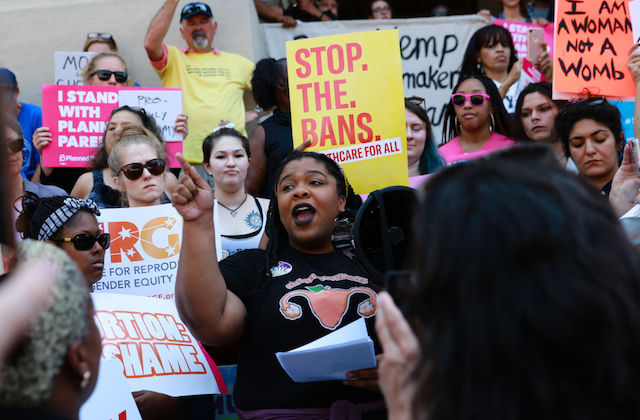 A group of women outdoors at a protest in support of abortion rights