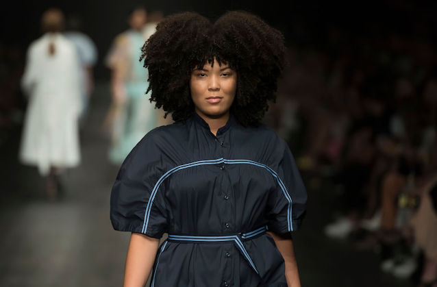Close-up of Black woman with long natural hair.