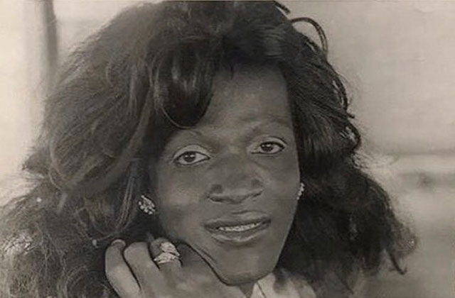 Marsha P. Johnson. Black and white photo of Black woman with long wavy hair.