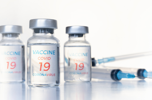 Transparent vials, syringes with new vaccine for covid-19 coronavirus, flu, infectious diseases.
