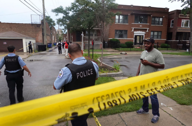 JULY 21: Police secure the scene of a shooting in the Auburn Gresham neighborhood on July 21, 2020 in Chicago, Illinois