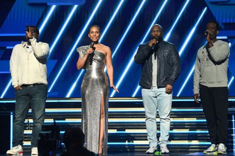 The Grammys. Alicia Keys with Boyz II Men Nathan Morris, Wanya Morris and Shawn Stockman on stage.