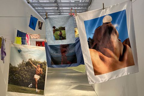 Tyler Mitchell art. Various oversized photographs hanging in art gallery before final installations.