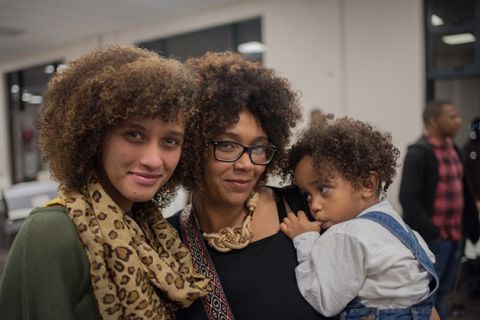 Three generations of Black people with curly hair.