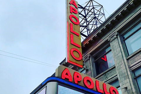 Apollo marquee. The Apollo Theater in the daytime with letters spelling out "Apollo" in red.