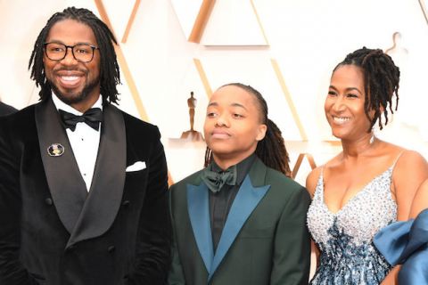 Hair Love. A Black man in a tuxedo with locs, a teen boy with locs in a tuxedo with blue lapels and a Black woman with locs and a silver and blue sequin gown.