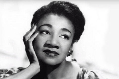 Alberta Hunter. Black and white photo of Black woman with chin in hand.