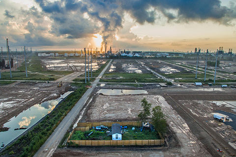 Mossville, Louisiana. Trailer standing alone in the middle of dug up ground for miles.