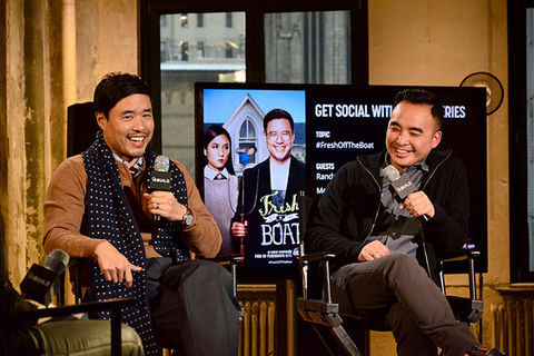 Randall Park and Melvin Mar. Two Asian American men seated side-by-side holding microphones in front of a TV screen that says "Fresh Off the Boat."