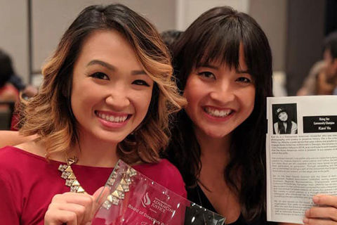Wake Up Atlanta. Two Vietnamese American women, one with shoulder-length blonde hair wearing a red top and the other with longer dark hair.