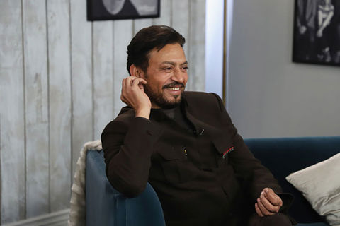 Irrfan Khan. South Asian Indian man with short dark hair wearing a black suit jacket and black shirt.