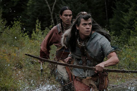 Barkskins. Film scene of two Indigenous men crossing a creek.