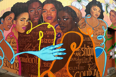 Brown Girl Narratives. Colorful mural featuring images of seven different Black women.