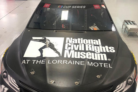 NASCAR. Black car with hood reading "National Civil Rights Museum at the Lorraine Motel" and a logo.