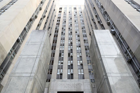 View looking up at tall state supreme court building in New York City.
