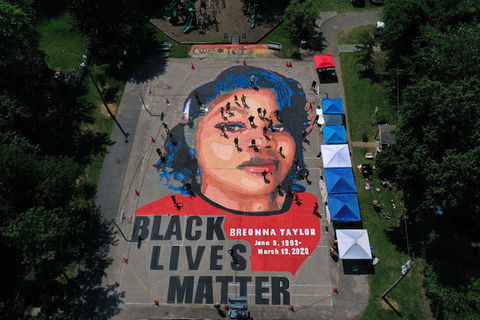 large mural on the ground of Breonna Taylor's face