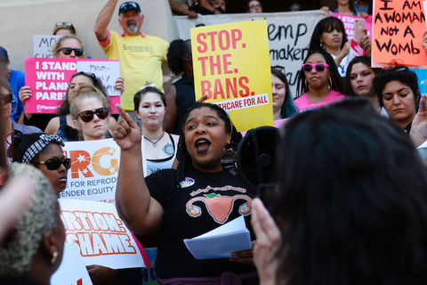 A group of women outdoors at a protest in support of abortion rights