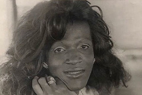 Marsha P. Johnson. Black and white photo of Black woman with long wavy hair.