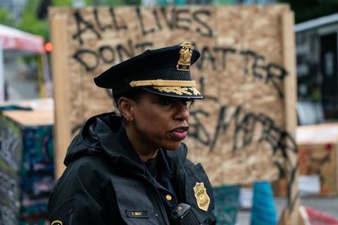 image of a Black woman in police uniform