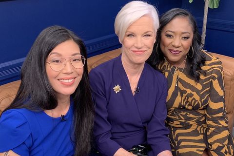 A trio of powerful Asian, white, and Black woman leaders pose on couch