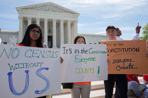 Census demonstration. Three people hold handmade signs demanding to be counted in the Census.