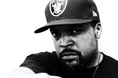 Ice Cube.Black man wearing a black Raiders baseball cap and black shirt.