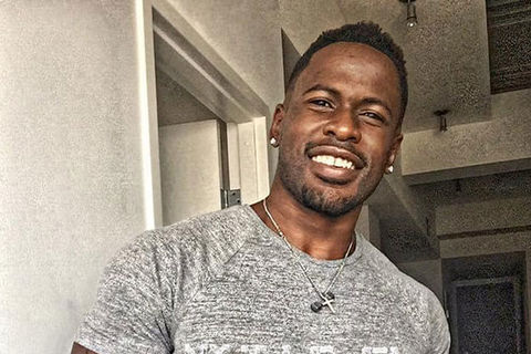 Jonathan Price. Black man with short dark hair and minor facial hair wearing a gray Tee.