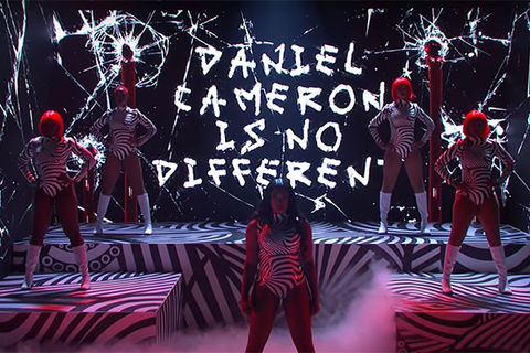 Megan Thee Stallion. Black and white stage props with five black women on stage wearing black and white costumes.