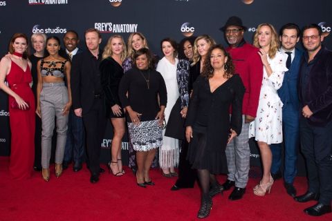 The cast of the ABC show, "Grey's Anatomy" on a red carpet including Black woman creator and writer, Shonda Rhimes.