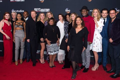 The cast of the ABC show, "Grey's Anatomy" on a red carpet including Black woman creator and writer, Shonda Rhimes.