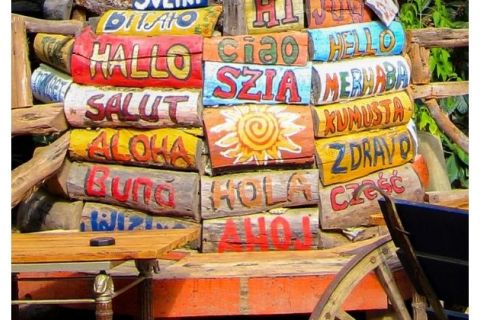 The word "hello" spelled out in different languages on brightly painted pieces of wood