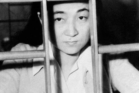 American born, Iva Toguri,  behind jail cell bars after being accused for treason