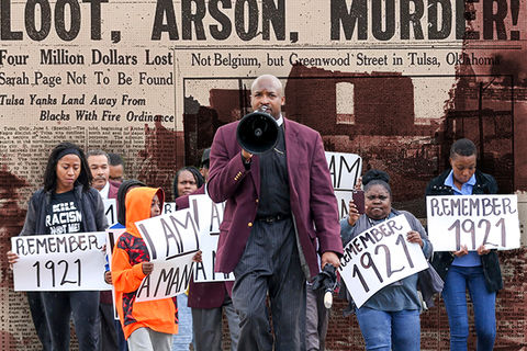 Dr. Robert Turner leads a group from the Vernon African Methodist Episcopal (AME) church to Tulsa City Hall, demanding “reparations now.”