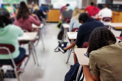 A photo of high school-age students in a classroom 