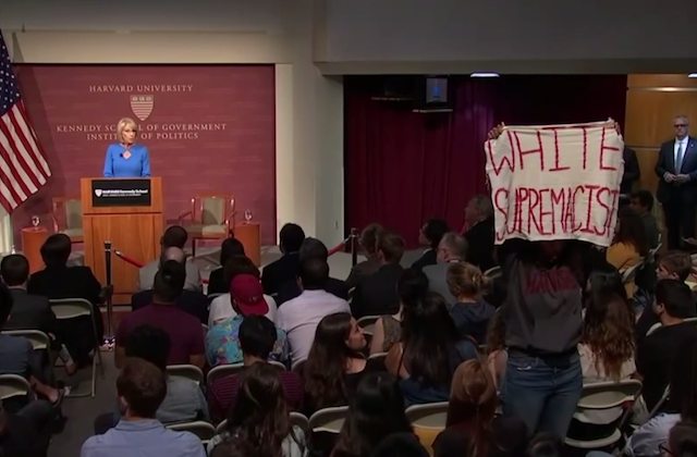 Harvard Students Protest Betsy DeVos With ‘White Supremacist’ Sign, Raised Fists